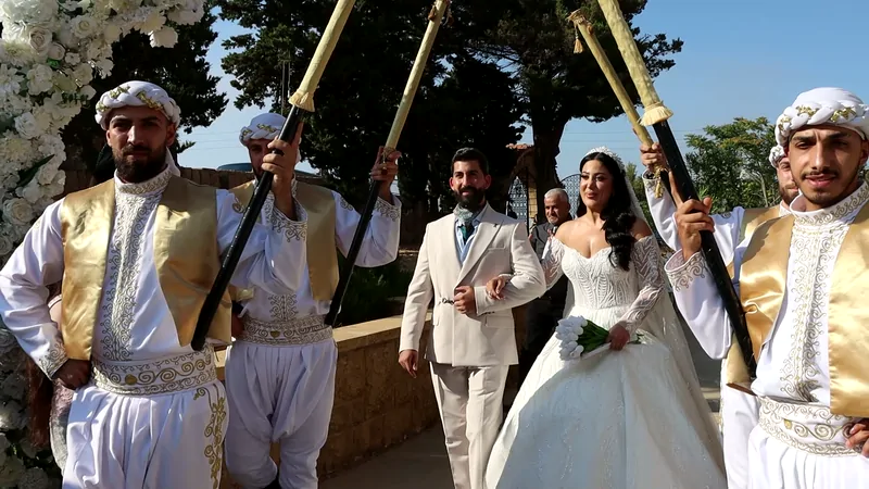 Zaffe dancers with swords leading the couple in