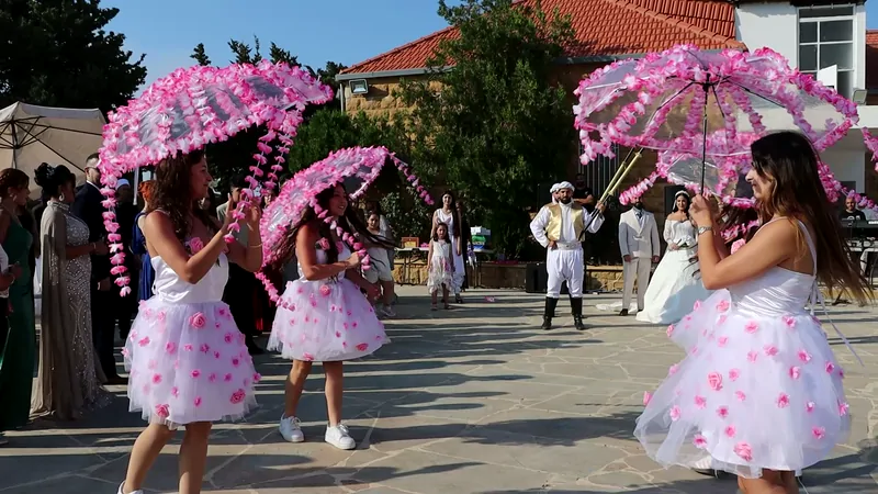 Dancers with pink parasols on the courtyard