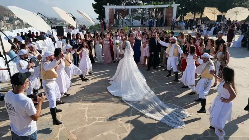 The bride with a long veil among the dancers