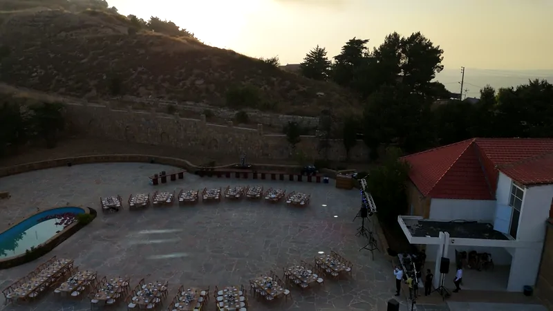 The courtyard at dusk, tables ready